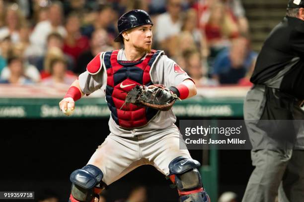 Catcher Christian Vazquez of the Boston Red Sox looks to throw out Carlos Santana of the Cleveland Indians at first during the sixth inning at...