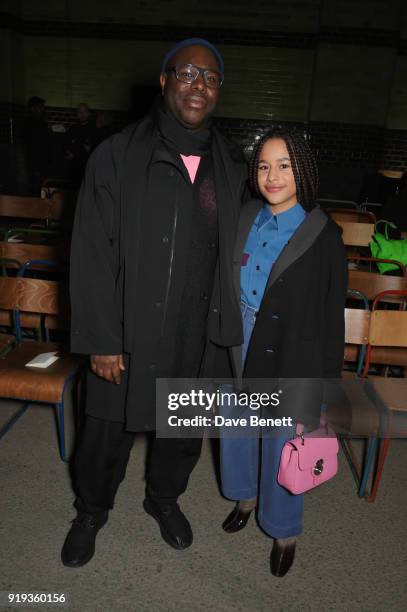 Steve McQueen and daughter Alex McQueen wearing Burberry at the Burberry February 2018 show during London Fashion Week at Dimco Buildings on February...