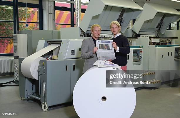 The two German entrepreneurs Wanja Soeren Oberhof and Hendrik Tiedemann of Niiu, the world's first individualised newspaper, stand in front of a...