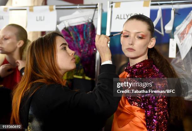 Model backstage ahead of the Halpern show during London Fashion Week February 2018 on February 17, 2018 in London, England.