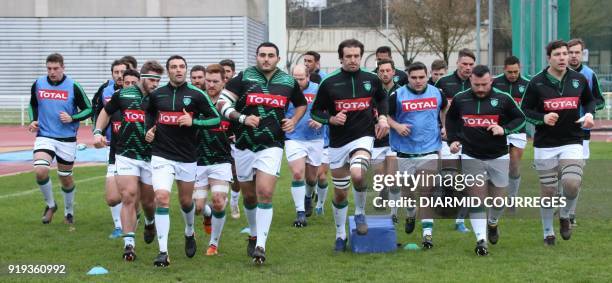 Pau's players warm up prior to the French Top 14 rugby union match CA Brive vs Pau on February 17, 2018 at the Amede Domenech stadium, in...