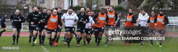 Brive's players warm up prior to the French Top 14 rugby union match CA Brive vs Pau on February 17, 2018 at the Amede Domenech stadium, in...