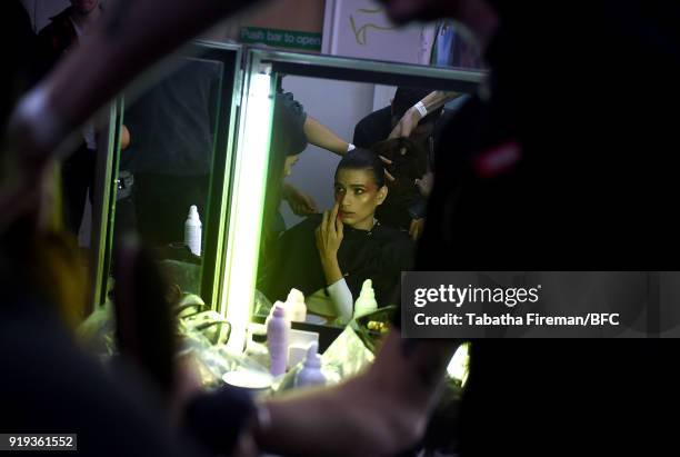 Model backstage ahead of the Halpern show during London Fashion Week February 2018 on February 17, 2018 in London, England.