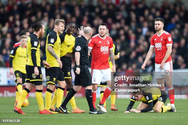 Referee Andy Davies has words with Nottingham Forest's Lee Tomlin during the Sky Bet Championship match between Burton Albion and Nottingham Forest...