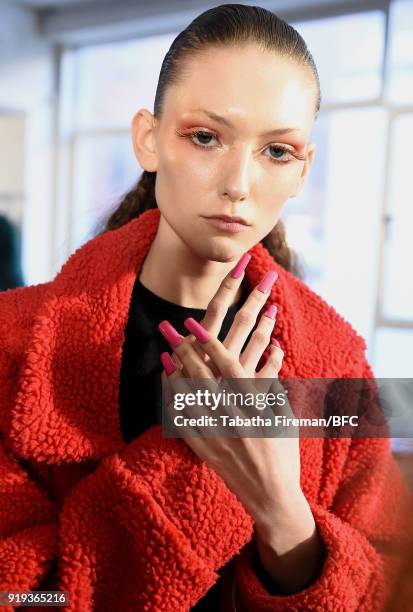 Model backstage ahead of the Halpern show during London Fashion Week February 2018 on February 17, 2018 in London, England.