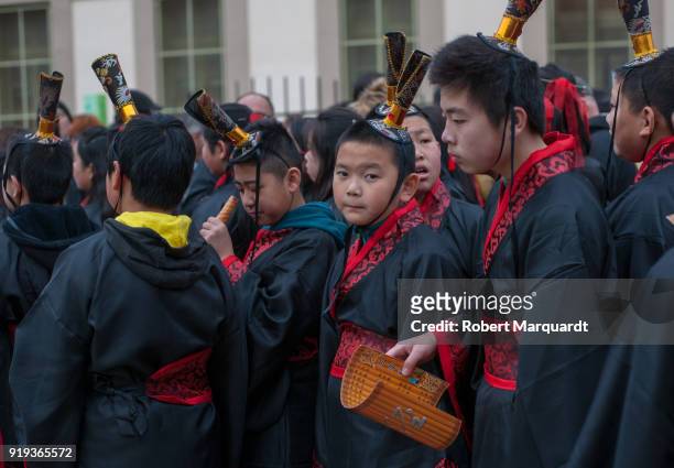 People participate during a parade for the Barcelona celebration of the Chinese Lunar New Year of the Dog on February 17, 2018 in Barcelona, Spain.