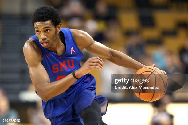 Jimmy Whitt of the Southern Methodist Mustangs dribbles the ball up the court during a NCAA basketball game against the UCF Knights at the CFE Arena...