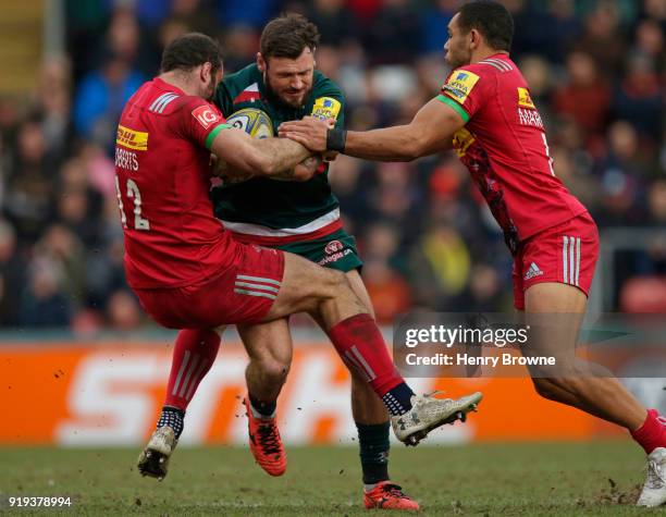 Adam Thompstone of Leicester Tigers tackled by Jamie Roberts and Joe Marchant of Harlequins during the Aviva Premiership match between Leicester...