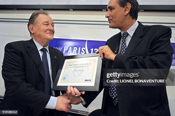 Albert Uderzo , French author and illustrator who launched the Asterix comics strip character with author Rene Goscinny, receives from the President...