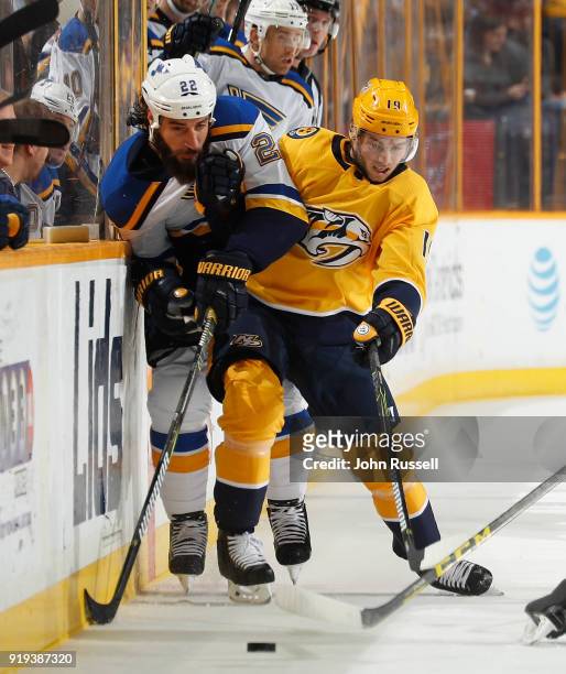 Calle Jarnkrok of the Nashville Predators skates against Chris Thorburn of the St. Louis Blues during an NHL game at Bridgestone Arena on February...