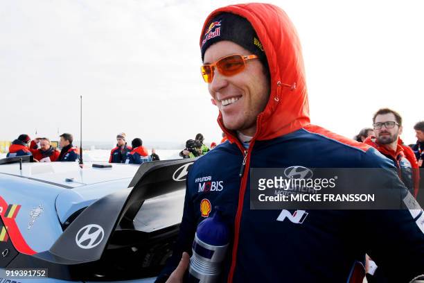 Thierry Neuville of Belgium smiles during a stopover on during day three of the Rally Sweden 2018 as part of the World Rally Championship in Torsby,...