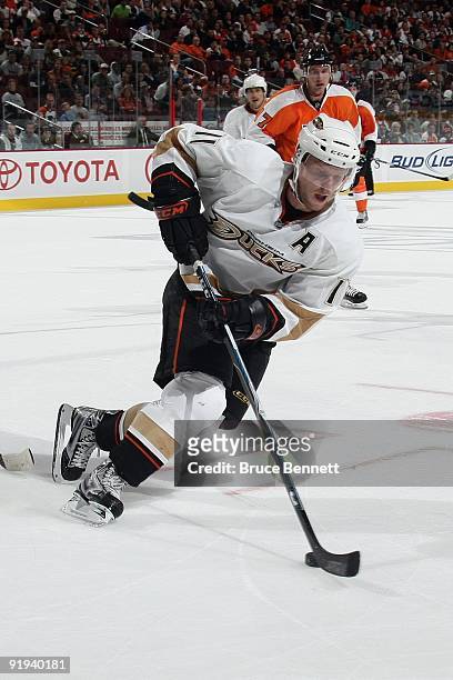 Saku Koivu of the Anaheim Ducks skates with the puck during the game against the Philadelphia Flyers at the Wachovia Center on October 10, 2009 in...