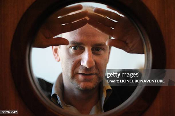 French illustrator Blutch poses on October 15, 2009 in Bobigny near Paris during a ceremony, as part of the "Droles de Gaulois" event, to honour...