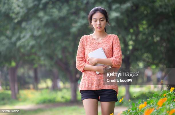 college girl students thinking and walking - beautiful college girls stock pictures, royalty-free photos & images