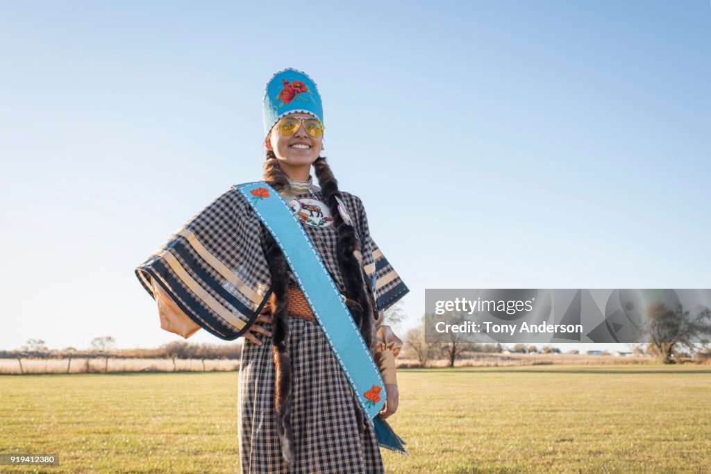 Young Native American woman in traditional regalia