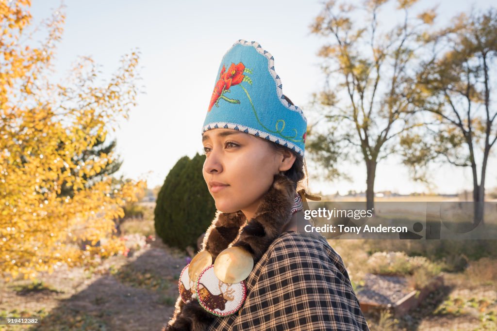 Young Native American woman in traditional regalia