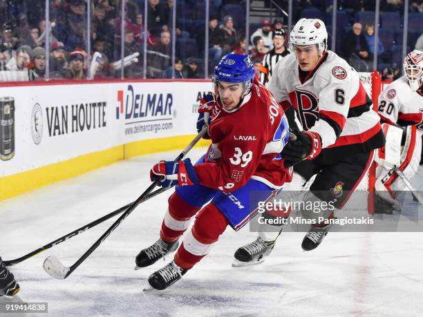 Jordan Boucher of the Laval Rocket skates against Andreas Englund of the Belleville Senators during the AHL game at Place Bell on February 14, 2018...