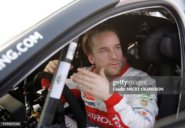 Mads Ostberg of Norway looks on during a stopover during day three of the Rally Sweden 2018 as part of the World Rally Championship in Torsby,...