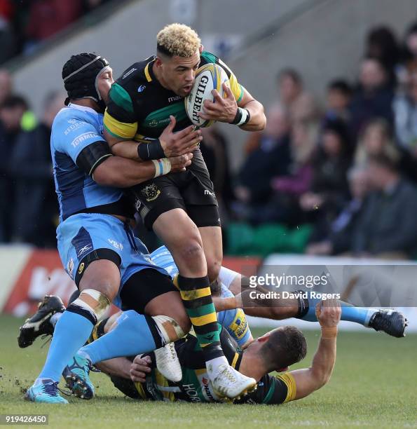 Luther Burrell of Northampton is tackled during the Aviva Premiership match between Northampton Saints and London Irish at Franklin's Gardens on...