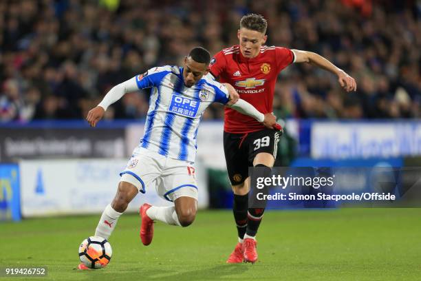 Rajiv van La Parra of Huddersfield battles with Scott McTominay of Man Utd during The Emirates FA Cup Fifth Round match between Huddersfield Town and...