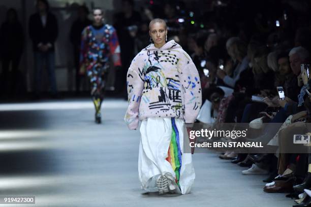 British model Adwoa Aboah presents a creation from the Burberry collection during their catwalk show on the second day of London Fashion Week...