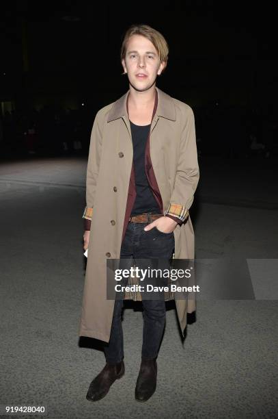 Musician Tom Odell wearing Burberry at the Burberry February 2018 show during London Fashion Week at Dimco Buildings on February 17, 2018 in London,...