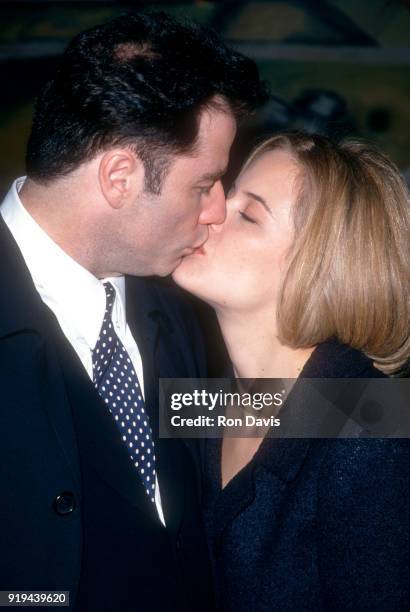 American actor John Travolta kisses his wife/actress Kelly Preston during the 20th Annual Los Angeles Film Critics Association Awards on January 17,...