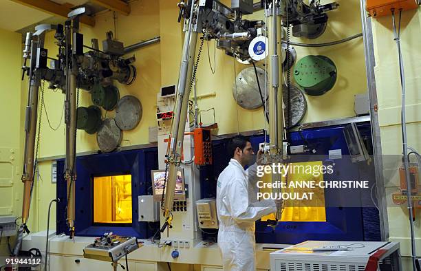 An engineer works on radioactive nuclear fuels at the Laboratory for irradiated fuels study LECA at the Cadarache nuclear research centre of the...