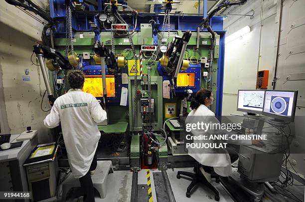 Engineers analyze radioactive nuclear fuels at the Laboratory for irradiated fuels study LECA at the Cadarache nuclear research centre of the CEA on...