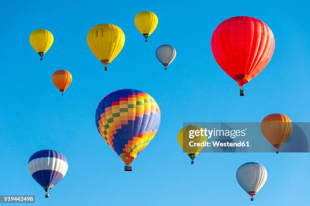 lithuania, vilnius, hot air balloons - balloons in sky stock pictures, royalty-free photos & images