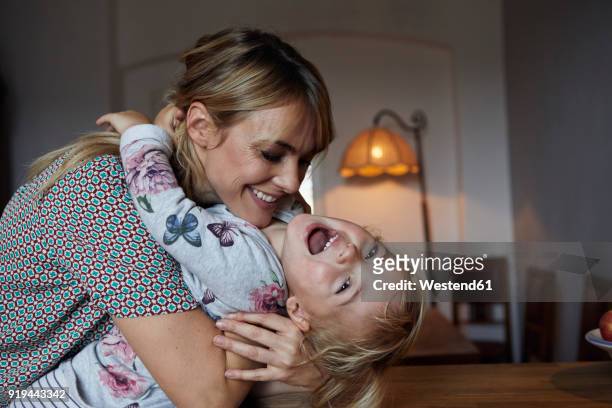 portrait of mother and little daughter at home - funny love stock pictures, royalty-free photos & images