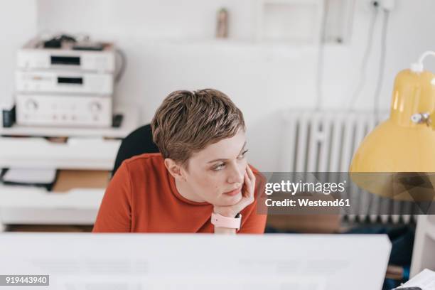 woman at desk in office thinking - person bored at work stock pictures, royalty-free photos & images