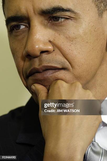 President Barack Obama looks on during a meeting with NATO Secretary General Anders Fogh Rasmussen in the Oval Office of the White House in...