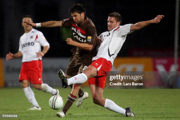 Florian Bruns of Pauli is challenged by Ronny Koenig of Oberhausen during the Second Bundesliga match between Rot-Weiss Oberhausen and FC St. Pauli...