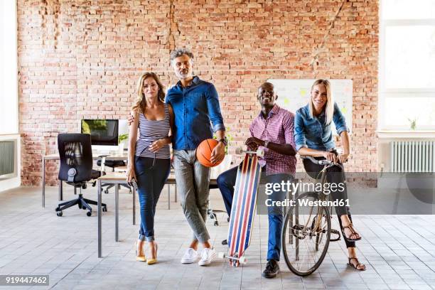 portrait of casual colleagues in office - dramatic millennials stock pictures, royalty-free photos & images
