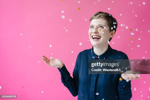 confetti falling on happy woman - portrait looking down stock pictures, royalty-free photos & images