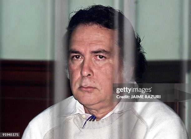 Panamanian Pacifico Castrillon waits the start of his new trial on terrorism, in Lima, for his alleged involvement with the MRTA 22 November 2002, in...