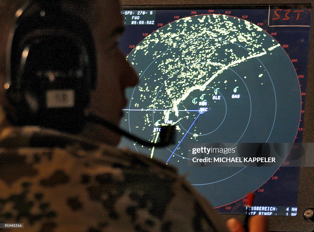 A member of the German Navy watches the