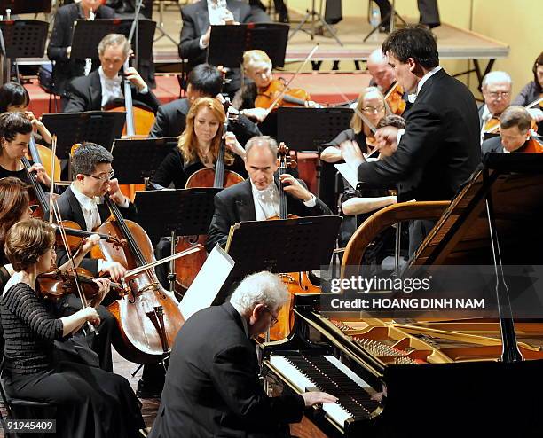 Pianist Emmanuel Ax plays Beethoven's Piano Concerto No. 4 with the New York Philharmonic conducted by music director Alan Gilbert during a concert...