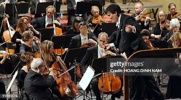 Music Director Alan Gilbert of the New York Philharmonic conducts his orchestra during a concert given at the Hanoi Opera House on October 16, 2009....