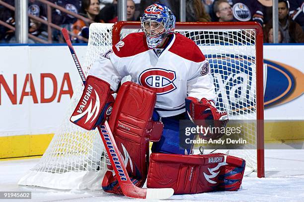 Carey Price of the Montreal Canadiens concentrates on the puck during a game against the Montreal Canadiens on October 10, 2009 at Rexall Place in...