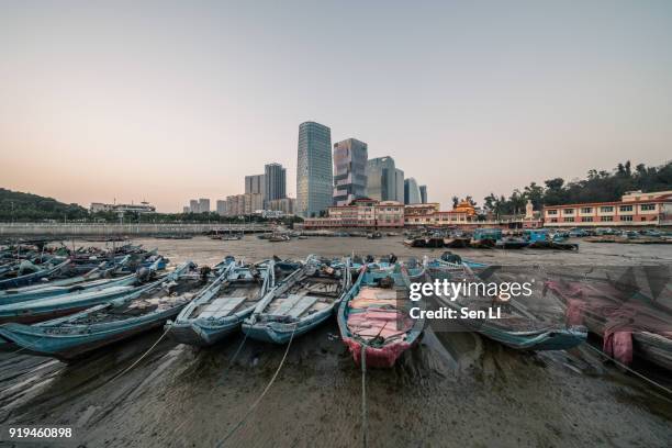 old fishing port and modern city center, xiamen - 城市 stock pictures, royalty-free photos & images