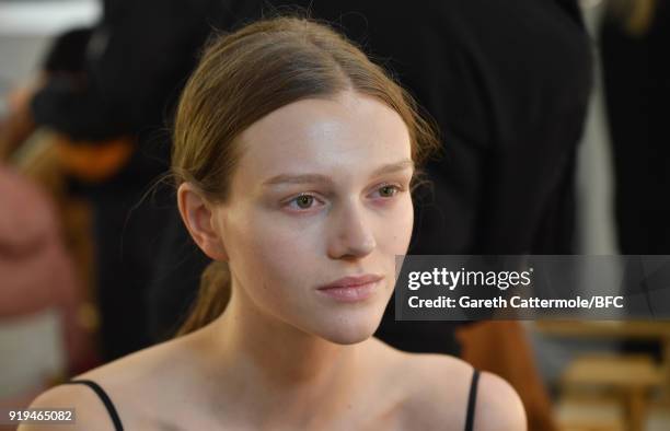 Model backstage ahead of the Burberry show during London Fashion Week February 2018 at Dimco Buildings on February 17, 2018 in London, England.