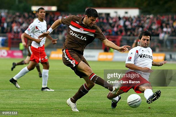 Florian Bruns of Pauli is challenged by Markus Kaya of Oberhausen during the Second Bundesliga match between Rot-Weiss Oberhausen and FC St. Pauli at...