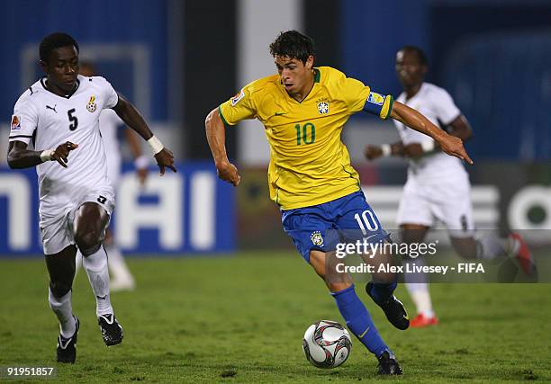 Giuliano of Brazil beats Daniel Addo of Ghana during the FIFA U20 World Cup Final between Ghana and Brazil at the Cairo International Stadium on...