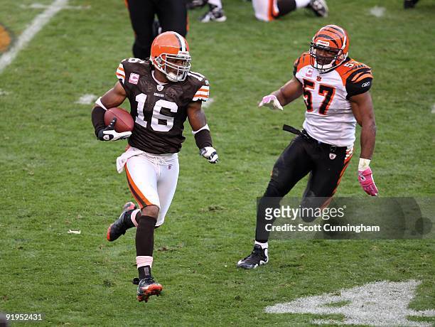 Joshua Cribbs of the Cleveland Browns carries the ball against Dhani Jones of the Cincinnati Bengals at Cleveland Browns Stadium on October 4, 2009...