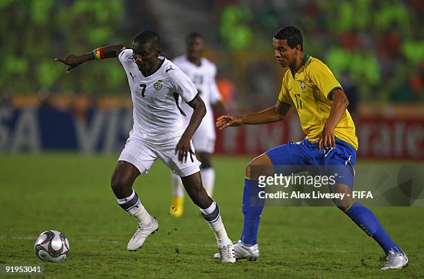 Abeiku Quansah of Ghana shields the ball from Souza of Brazil during the FIFA U20 World Cup Final between Ghana and Brazil at the Cairo International...