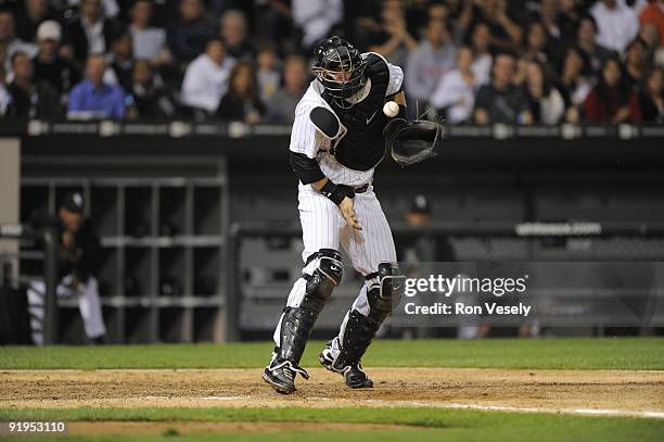 Pierzynski of the Chicago White Sox can't catch the ball as Nick Punto of the Minnesota Twins scores in the sixth inning on September 21, 2009 at...