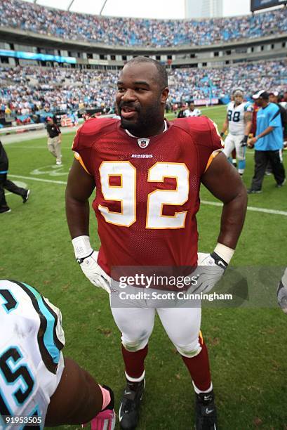 Albert Haynesworth of the Washington Redskins relaxes on the field after the game against the Carolina Panthers at Bank of America Stadium on October...