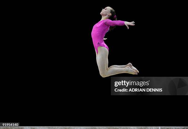 Gymnast Rebecca Bross performs in the balance beam event in the women's individual all-around final during the Artistic Gymnastics World...